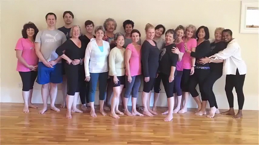 Photo of 2013 August retreat participants against Studio wall