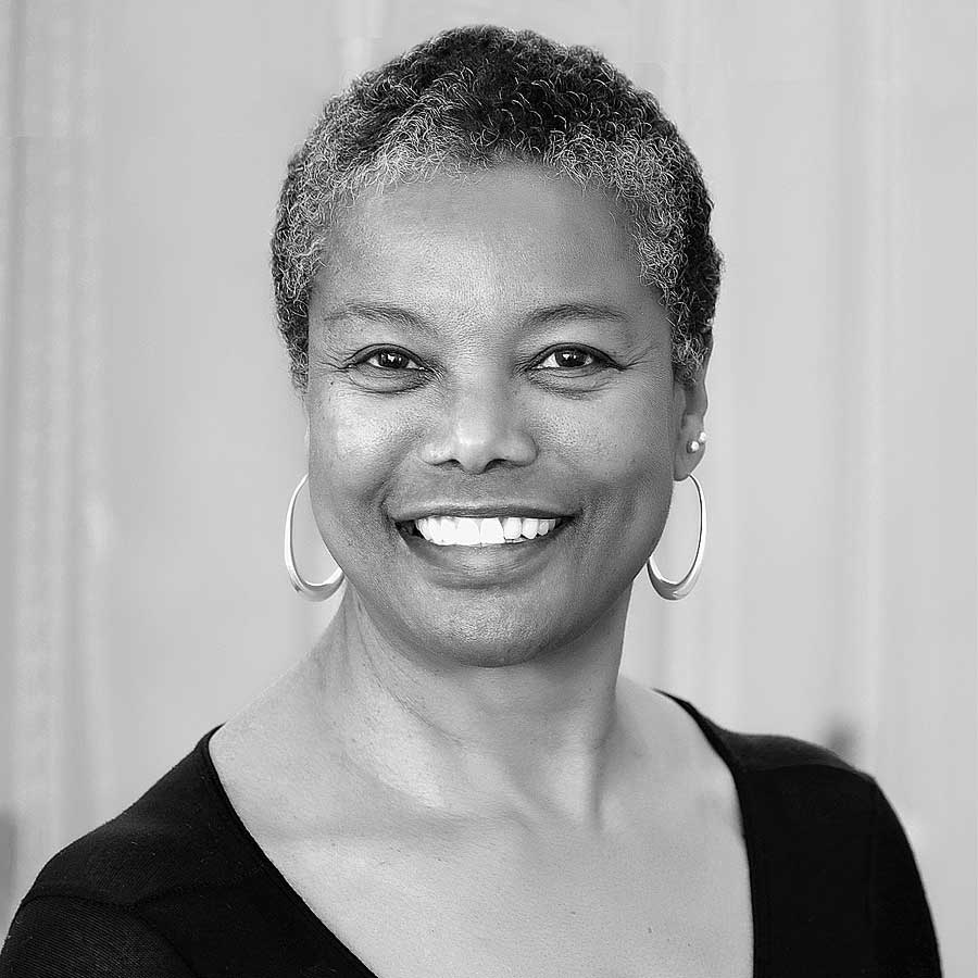 Photo of Jaki Nett, posing, in grayscale